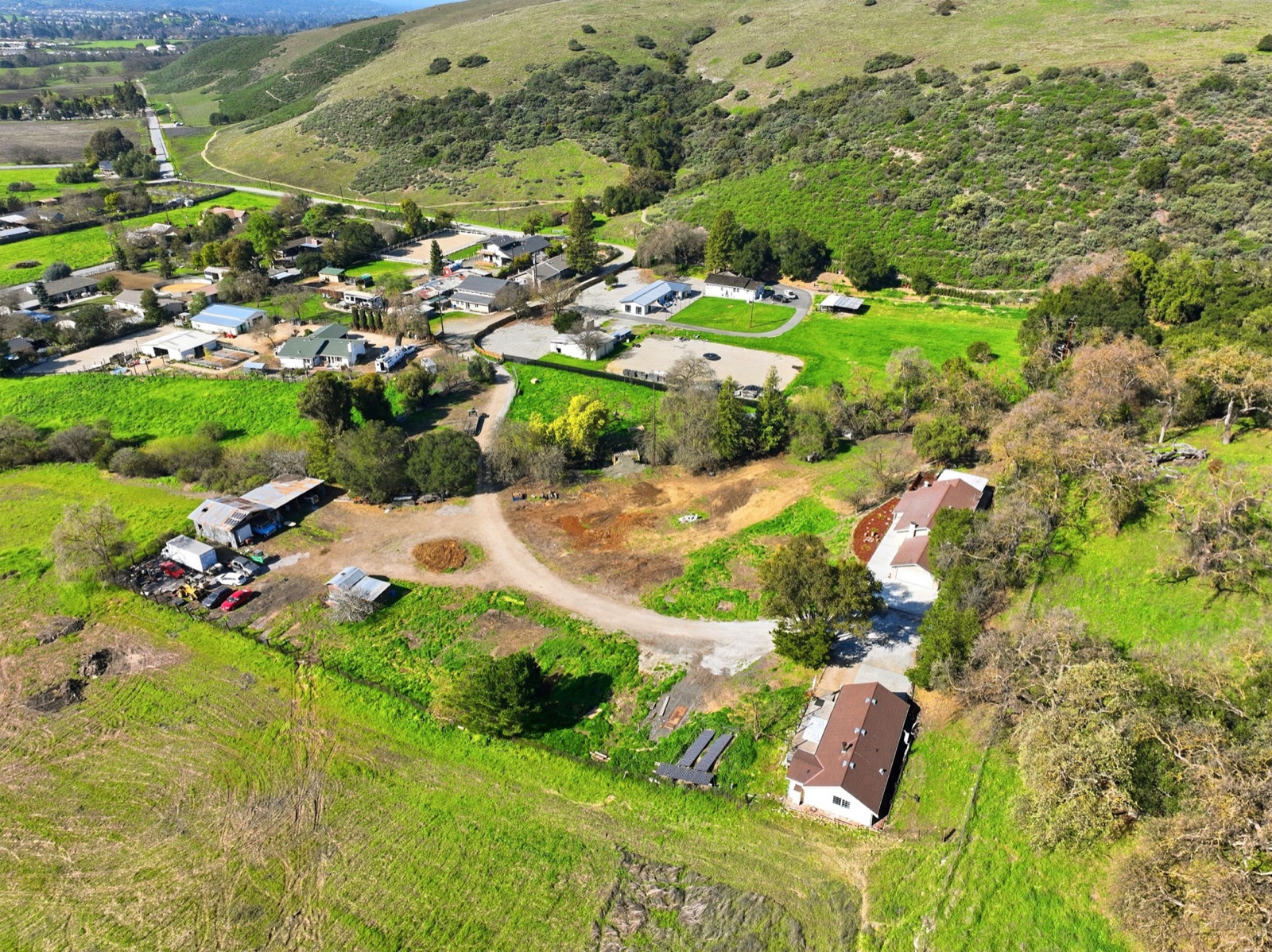 Aerial showing the property within the rural neighborhood