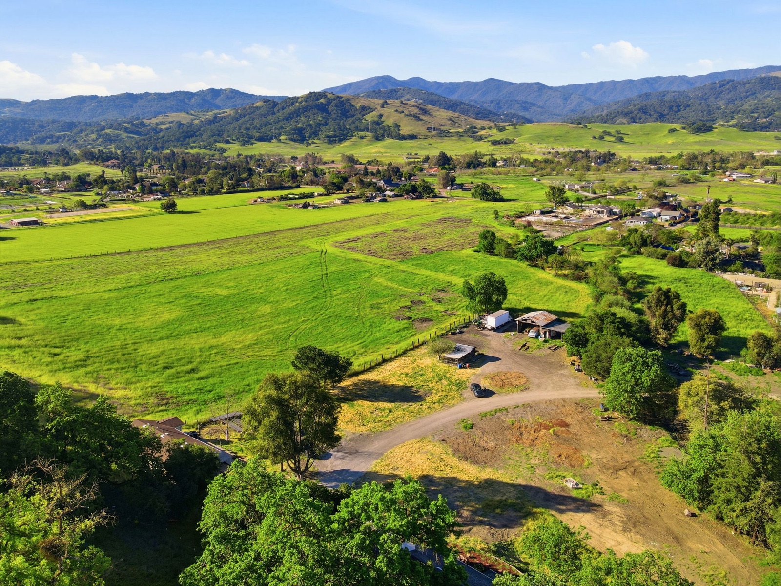 Aerial panorama over the property toward the Santa Cruz Mountains